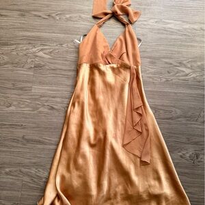 Minelli Red Logo Tag on Beige Fabric